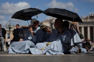 People wait in St. Petrov square for smoke signal from the conclave